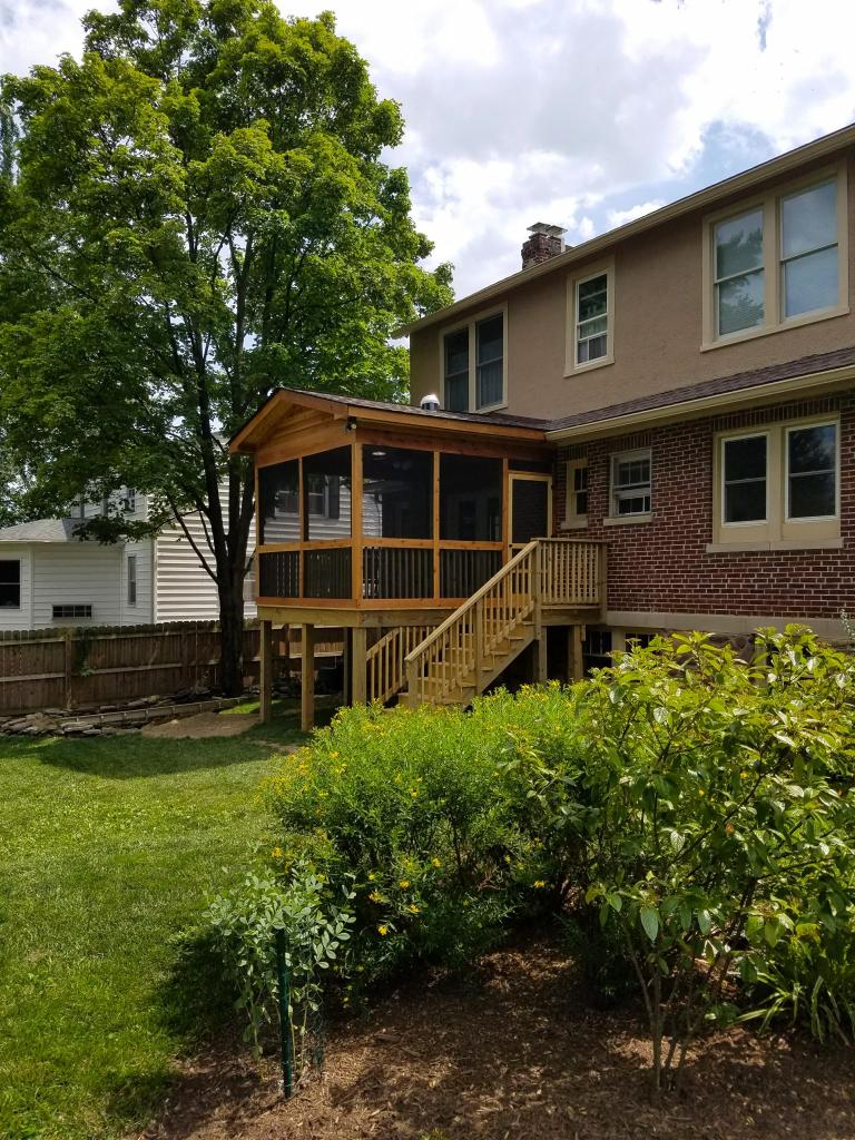 new Elevated Screened In Porch Deck With Wood Stairs And Backyard With Wood Fence
