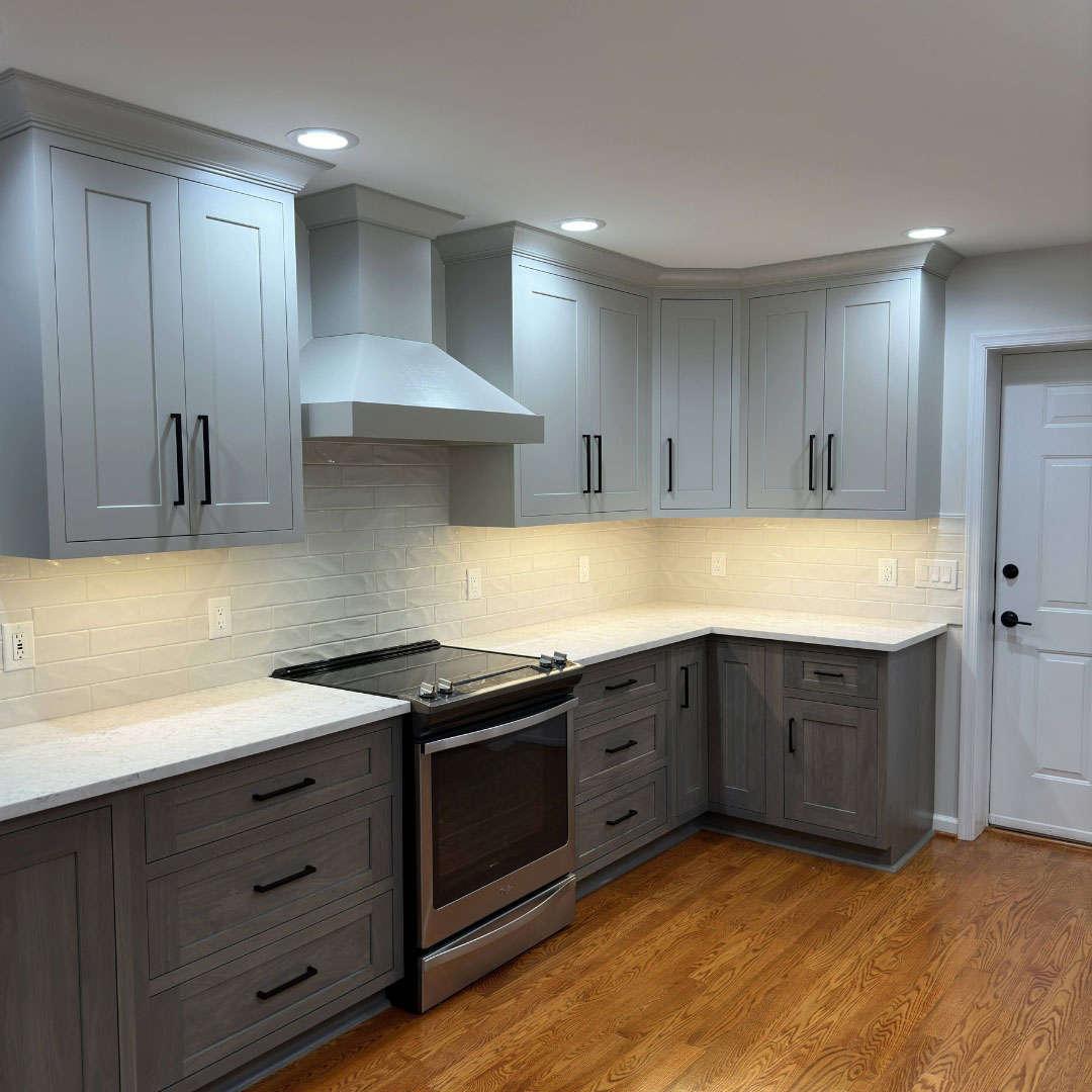 kitchen with built in hood range and stainless steel appliances